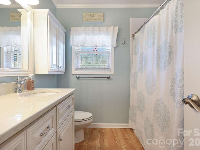 103 Oriole Road, New London, NC 28127.  MLS# CAR4335932, YatesRealty ID 972. Updated main level bath, custom cabinets, quartz countertops, tub/shower