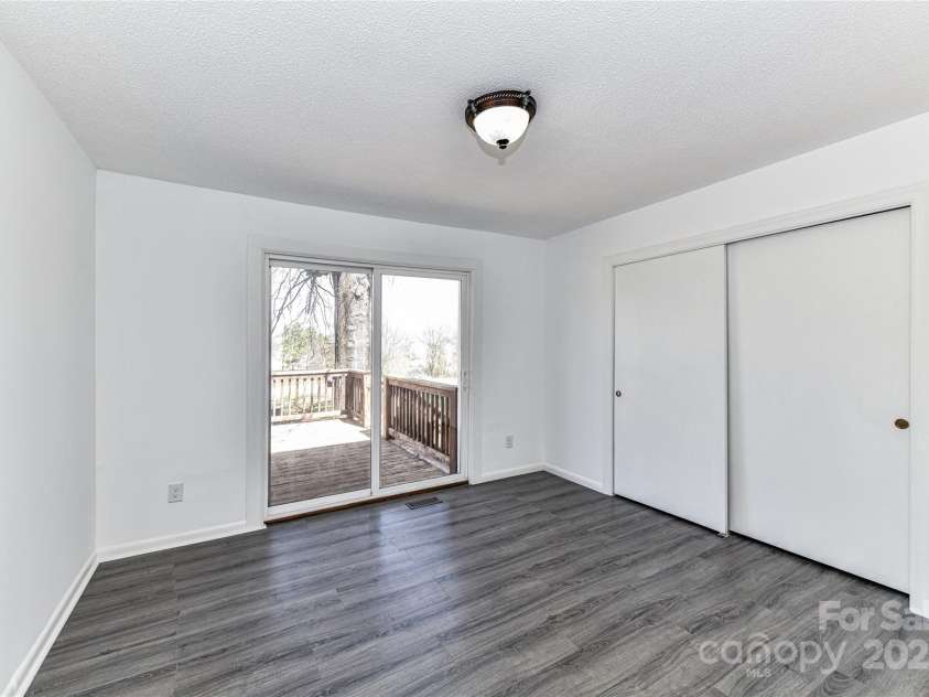 7770 Sherrills Ford Road, Sherrills Ford, NC 28673.  MLS# CAR4229083, YatesRealty ID 9721. Spacious Bedroom 3 with Deck access!