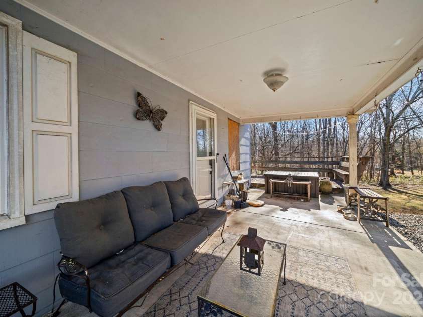 7670 NC Hwy 73 Highway, Mount Pleasant, NC 28124.  MLS# CAR4331448, YatesRealty ID 9727. Side Porch/Entrance 