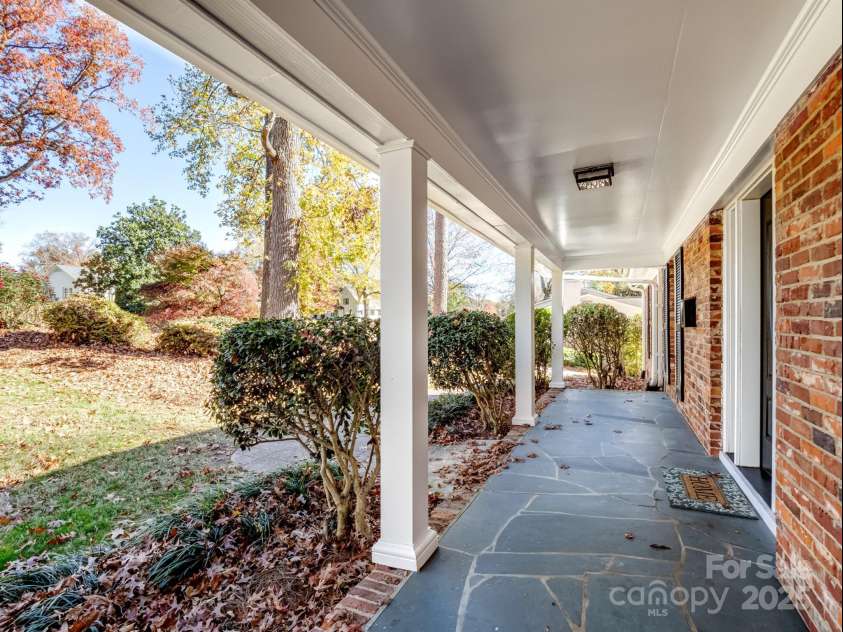 2111 Sagamore Road, Charlotte, NC 28209.  MLS# CAR4323130, YatesRealty ID 973. Covered slate front porch