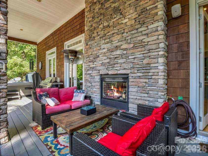 167 Trails End, Lake Lure, NC 28746.  MLS# CAR4245504, YatesRealty ID 9733. Upper deck see-thru FP
