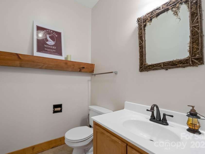 140 Spruce Hollow Road, Beech Mountain, NC 28604.  MLS# CAR4263469, YatesRealty ID 9744. Half Bath off of Kitchen