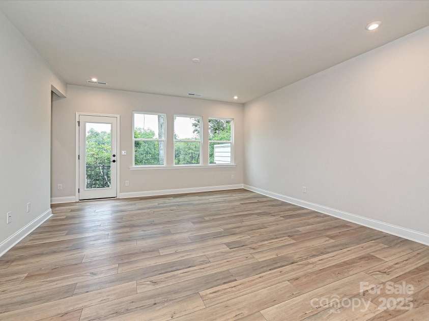 8034 Cedarsmith Court, Charlotte, NC 28217.  MLS# CAR4308403, YatesRealty ID 9744. Great Room Leading to Outdoor Living.