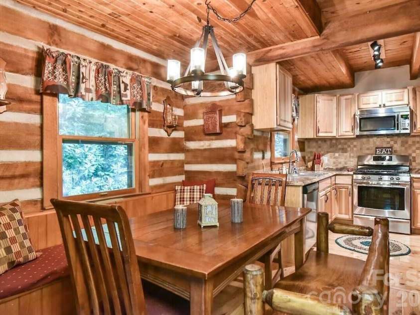 48 Buck Ridge Road, Fairview, NC 28730.  MLS# CAR4290270, YatesRealty ID 9748. Main level kitchen and dining
