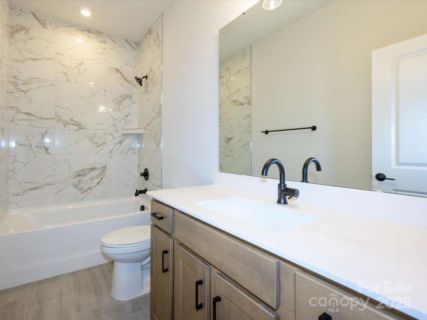 403 Old Town Village Road, Waxhaw, NC 28173.  MLS# CAR4308309, YatesRealty ID 9749. Secondary Bathroom With Upgraded Tile Shower.