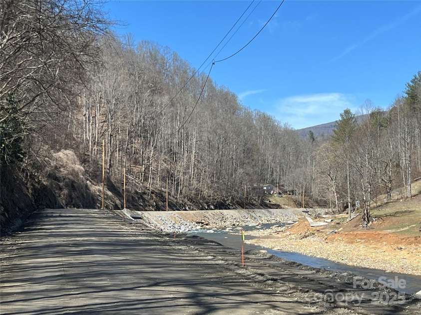 12982 US Hwy 19W None, Burnsville, NC 28714.  MLS# CAR4234088, YatesRealty ID 975. River view facing house since hurrican Helene.
