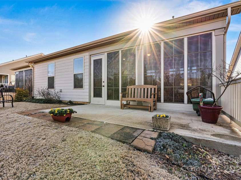 7029 Overjoyed Crossing, Charlotte, NC 28215.  MLS# CAR4212396, YatesRealty ID 9751. The extended rear patio is the perfect place for grilling out and overlooks the private FENCED rear yard with irrigation that is supplied by the community well.