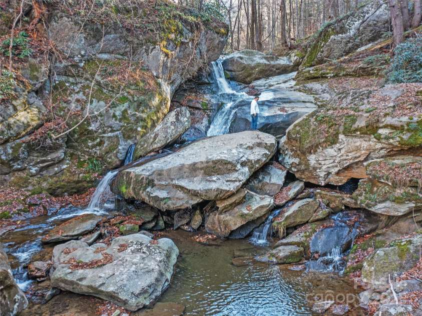 23 Katies Road, Marshall, NC 28753.  MLS# CAR4203088, YatesRealty ID 976. 30-40 Foot waterfall.  Paw Paw Creek Runs through property.  