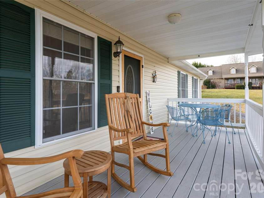 16 Kinsale Drive, Leicester, NC 28748.  MLS# CAR4340281, YatesRealty ID 9765. Front porch sitting