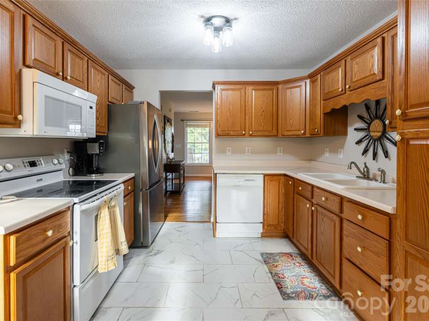 16 Kinsale Drive, Leicester, NC 28748.  MLS# CAR4340281, YatesRealty ID 9765. Functional kitchen