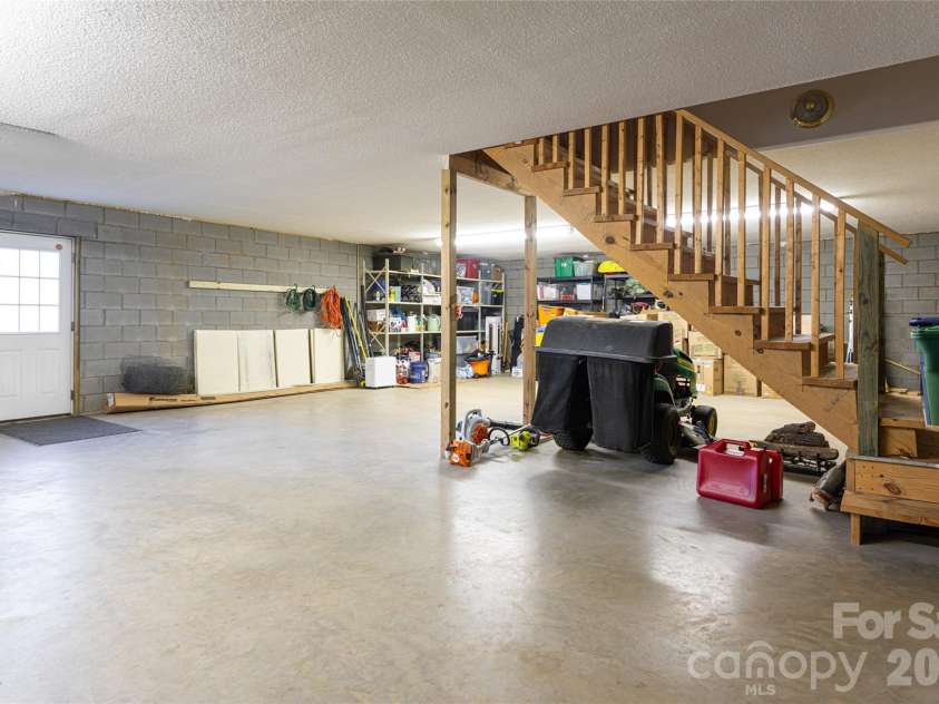 16 Kinsale Drive, Leicester, NC 28748.  MLS# CAR4340281, YatesRealty ID 9765. Unfinished basement