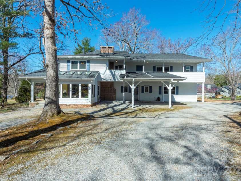 1740 Haywood Road, Hendersonville, NC 28791.  MLS# CAR4226897, YatesRealty ID 977. Ample parking space with a portico, providing convenience and protection from the elements.