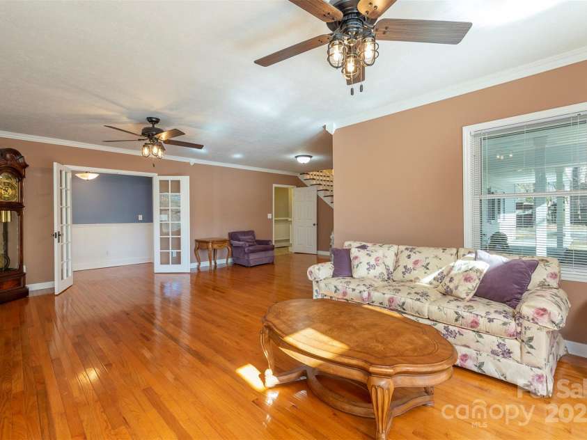 1740 Haywood Road, Hendersonville, NC 28791.  MLS# CAR4226897, YatesRealty ID 977. As you step through the front porch, you're welcomed into a spacious and inviting living room, perfect for relaxation and entertaining.