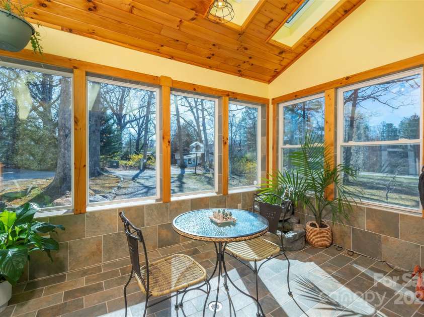 1740 Haywood Road, Hendersonville, NC 28791.  MLS# CAR4226897, YatesRealty ID 977. Create a perfect balance of indoor and outdoor living, bringing the beauty of nature inside,