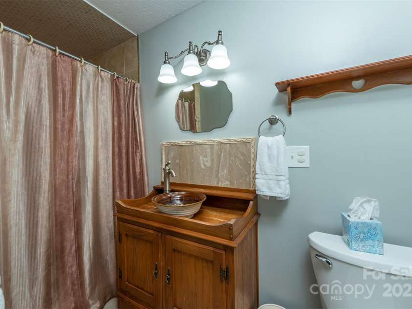 1740 Haywood Road, Hendersonville, NC 28791.  MLS# CAR4226897, YatesRealty ID 977. Ensuite bathroom attached to fifth bedroom