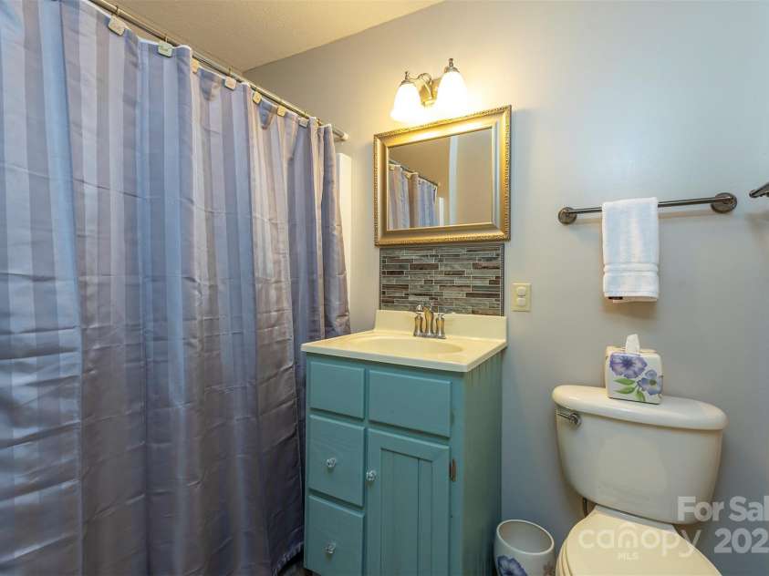 1740 Haywood Road, Hendersonville, NC 28791.  MLS# CAR4226897, YatesRealty ID 977. Ensuite bathroom attached to the fourth bedroom,
