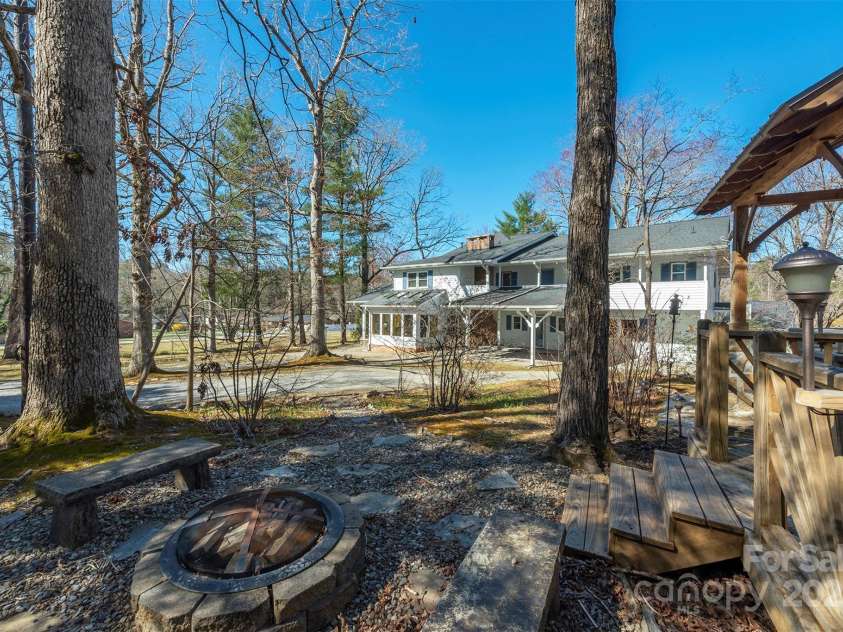 1740 Haywood Road, Hendersonville, NC 28791.  MLS# CAR4226897, YatesRealty ID 977. Outdoor firepit, ideal for cozy gatherings and enjoying evenings under the stars