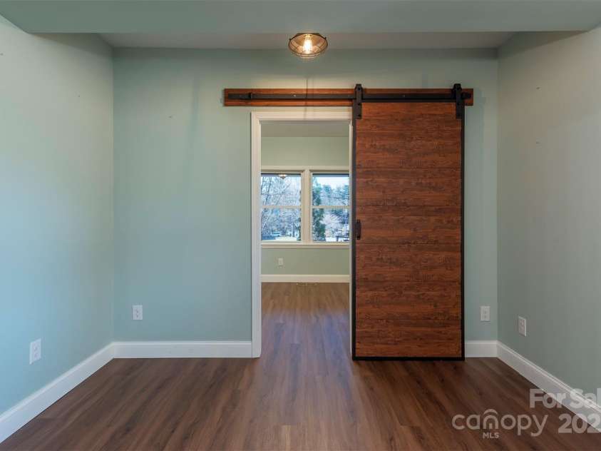 1740 Haywood Road, Hendersonville, NC 28791.  MLS# CAR4226897, YatesRealty ID 977. Private entry with separate access to the office/bonus room, offering flexibility and privacy.