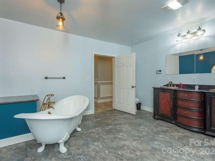 1740 Haywood Road, Hendersonville, NC 28791.  MLS# CAR4226897, YatesRealty ID 977. Recently updated, spacious downstairs bathroom, offering plenty of room and convenience.