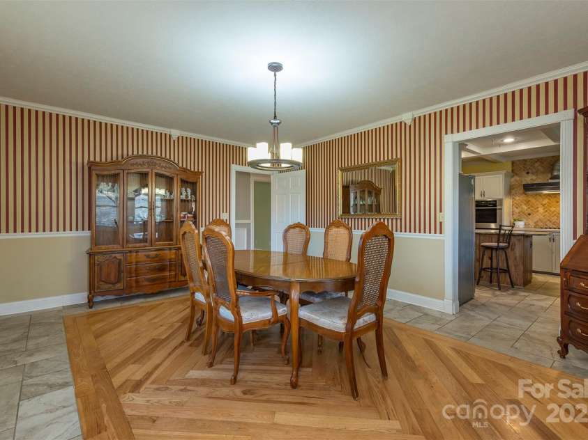 1740 Haywood Road, Hendersonville, NC 28791.  MLS# CAR4226897, YatesRealty ID 977. Spacious dining room ideal for hosting large gatherings and special occasions.