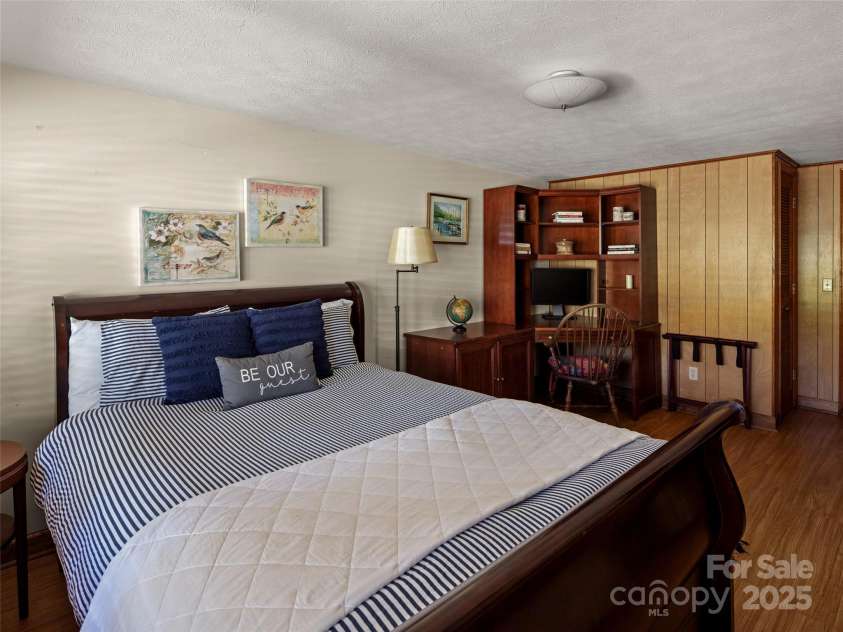 250 Mondamin Road, Zirconia, NC 28790.  MLS# CAR4248567, YatesRealty ID 9771. Main house lower level bedroom