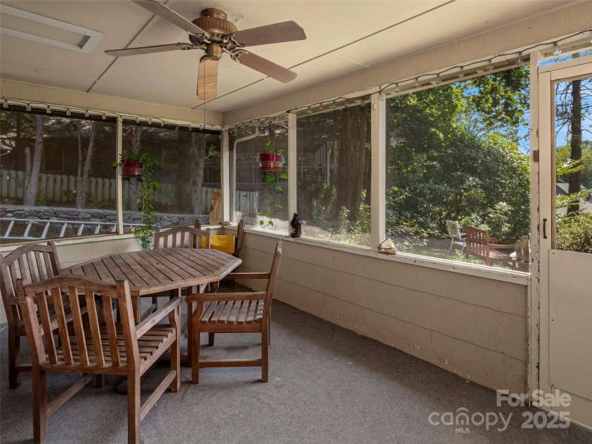 250 Mondamin Road, Zirconia, NC 28790.  MLS# CAR4248567, YatesRealty ID 9771. Main house screened front porch