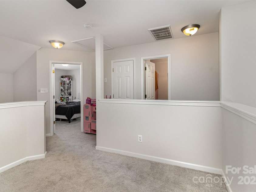 1751 Holliford Court, Charlotte, NC 28215.  MLS# CAR4227714, YatesRealty ID 9772. Loft Area - View of Bedroom 2 and Bathroom