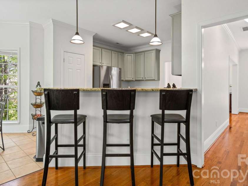 1520 Hawthorne Drive, Indian Trail, NC 28079.  MLS# CAR4365471, YatesRealty ID 9773. The Convenient Breakfast Bar Provides Additional Seating and Great Serving Area