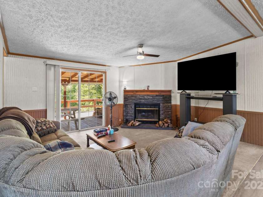 145 McCreek Drive, China Grove, NC 28023.  MLS# CAR4252985, YatesRealty ID 9777. Family room with fireplace