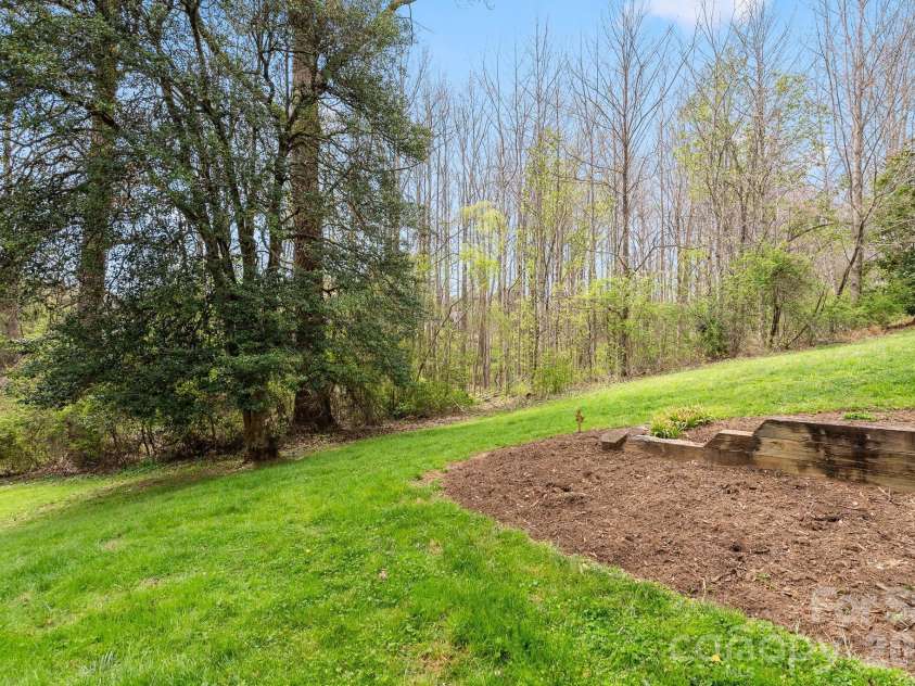 73 Creeks End Circle, Mills River, NC 28759.  MLS# CAR4365909, YatesRealty ID 9791. Serene Backyard