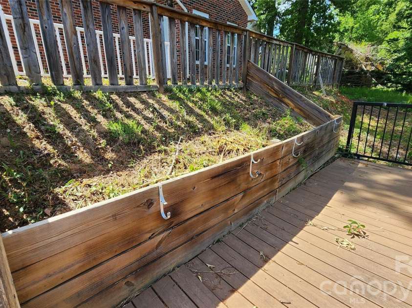 200 Park Place, Morganton, NC 28655.  MLS# CAR4367466, YatesRealty ID 9800. Planter, fence, deck at pool area