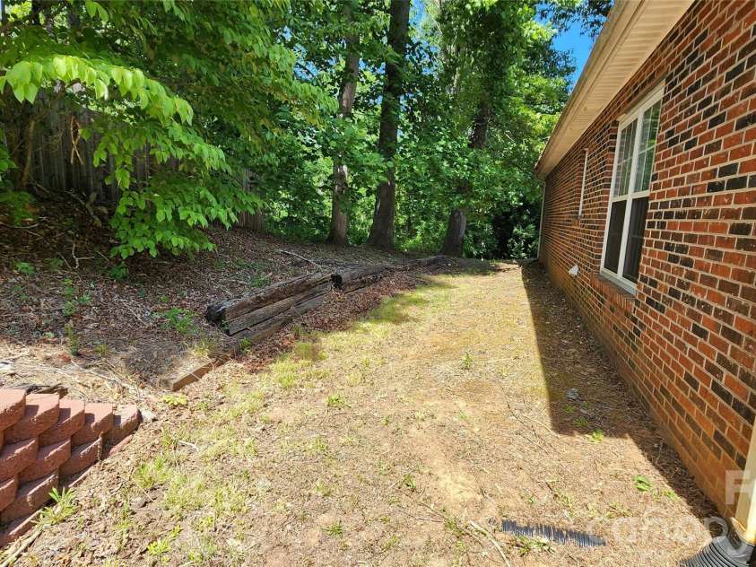 200 Park Place, Morganton, NC 28655.  MLS# CAR4367466, YatesRealty ID 9800. Rear Elevation has partial privacy fence