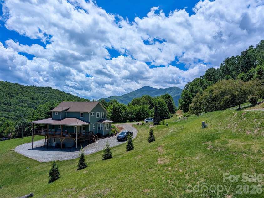 338 Majestic Mountain Drive, Burnsville, NC 28714.  MLS# CAR4277521, YatesRealty ID 981. Additional mountain view from front side covered porch