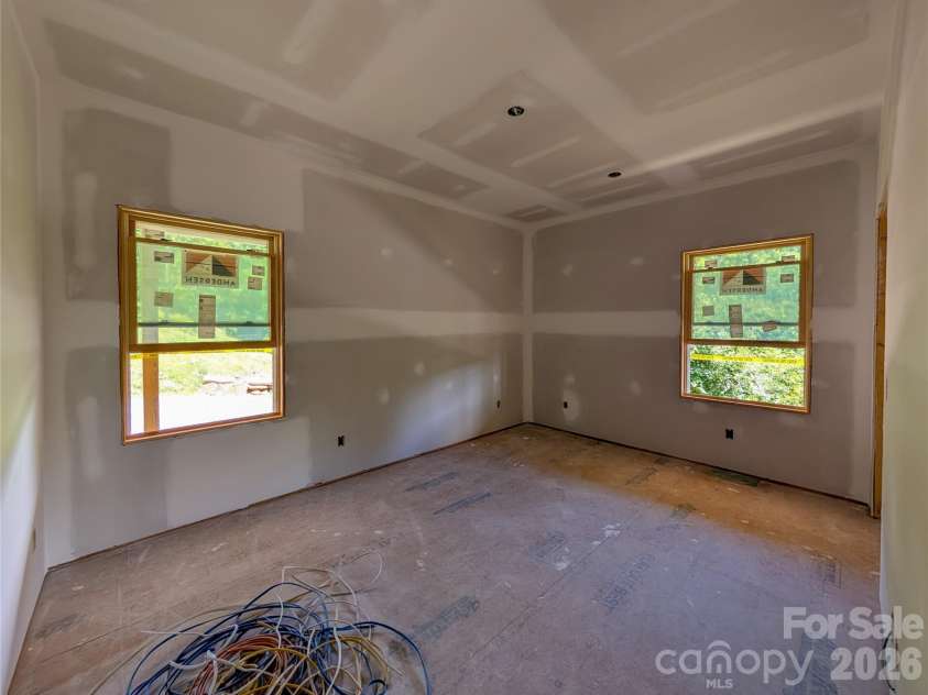 338 Majestic Mountain Drive, Burnsville, NC 28714.  MLS# CAR4277521, YatesRealty ID 981. Bedroom off from Great Room on main level