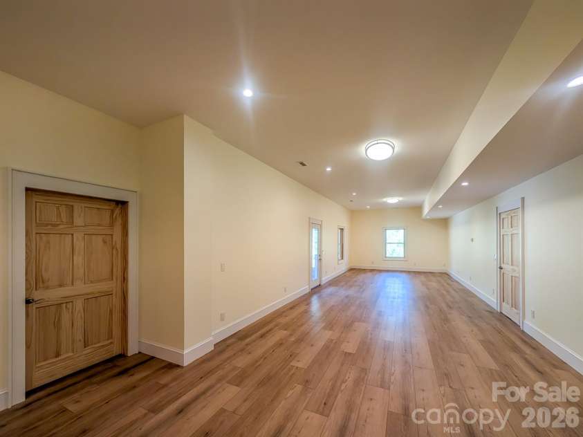 338 Majestic Mountain Drive, Burnsville, NC 28714.  MLS# CAR4277521, YatesRealty ID 981. Fully Finished Downstairs offers flexible spacious room that would be ideal for Media, Recreation & More! Includes Outdoor Access, Under the Stairs Storage, Spacious Bedroom with private en-suite bathroom & More