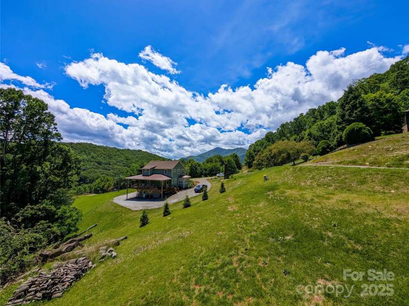338 Majestic Mountain Drive, Burnsville, NC 28714.  MLS# CAR4277521, YatesRealty ID 981. View from front side covered porch