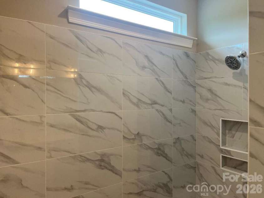262 Corrie Ann Drive, Concord, NC 28027.  MLS# CAR4402498, YatesRealty ID 9812. Primary Tile Shower with Transom Window