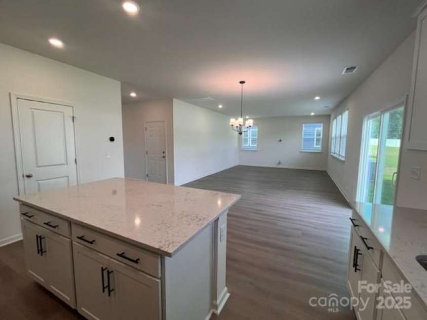 12131 Plummer Court, Midland, NC 28107.  MLS# CAR4216972, YatesRealty ID 9814. Island and Family room