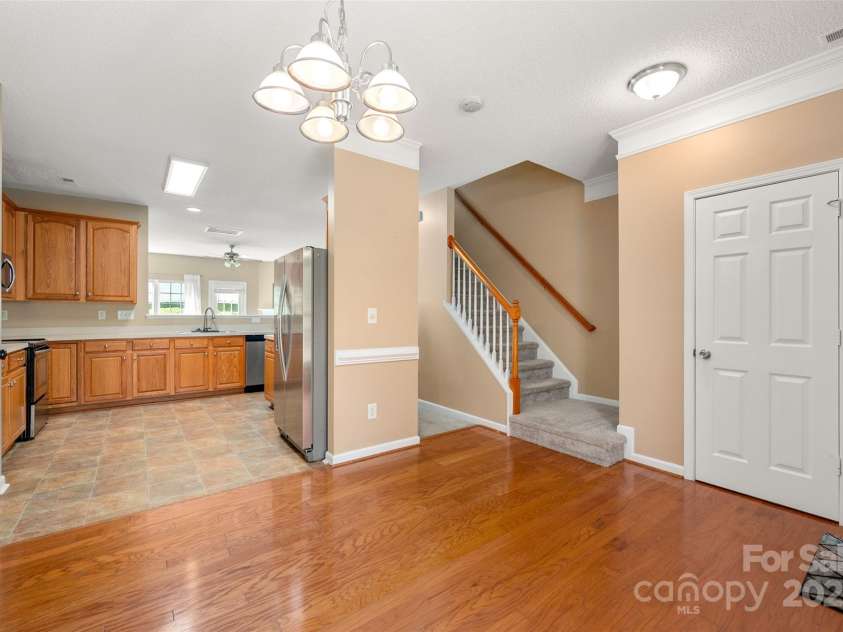6934 Tanners Creek Drive, Huntersville, NC 28078.  MLS# CAR4303299, YatesRealty ID 9819. Entry Hall with Dining area open to the Kitchen, convenient half bathroom located on the right