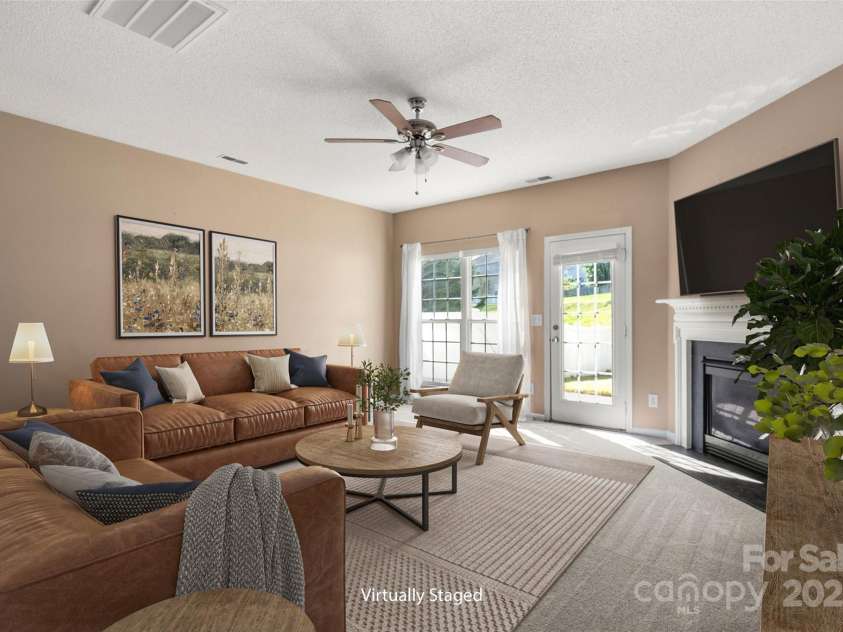 6934 Tanners Creek Drive, Huntersville, NC 28078.  MLS# CAR4303299, YatesRealty ID 9819. Open living room with Gas fireplace