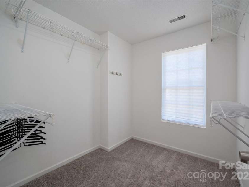 6934 Tanners Creek Drive, Huntersville, NC 28078.  MLS# CAR4303299, YatesRealty ID 9819. Primary suite walk-in closet