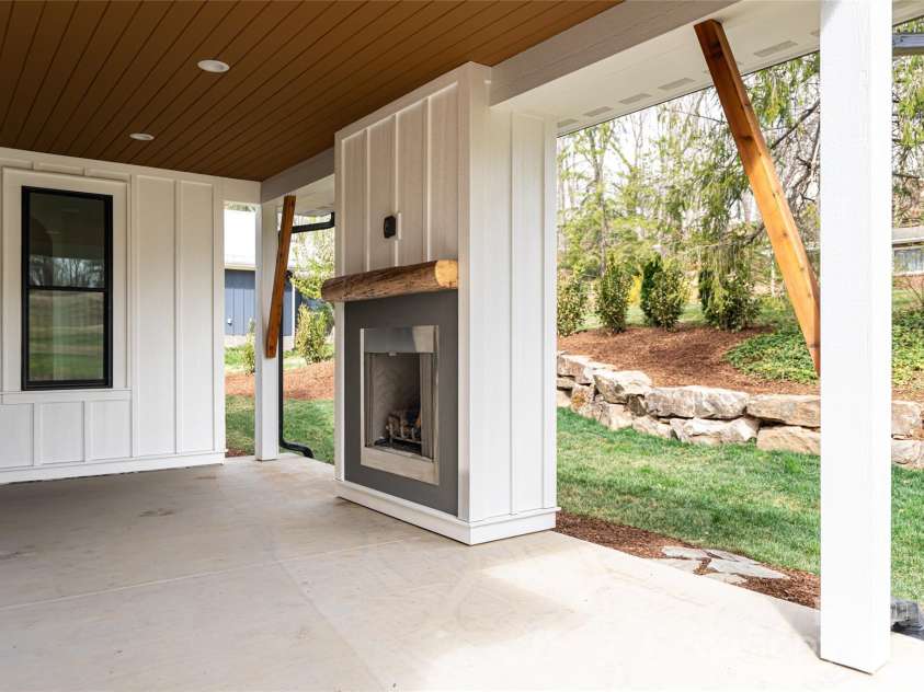 251 Bee Tree Road, Swannanoa, NC 28778.  MLS# CAR4238018, YatesRealty ID 9826. Back porch fireplace