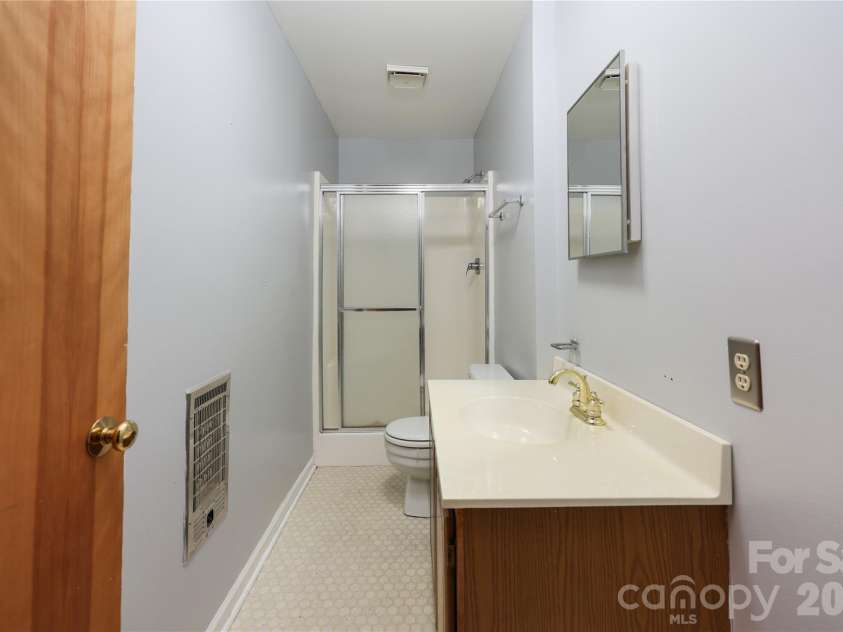 682 Cecil Street, Thomasville, NC 27360.  MLS# CAR4411361, YatesRealty ID 9827. 2nd bath in basement