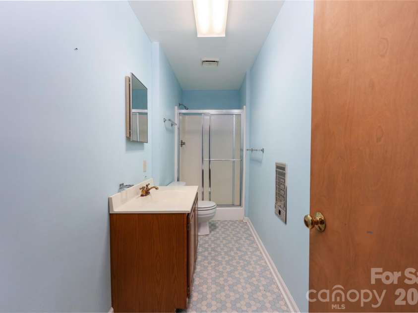682 Cecil Street, Thomasville, NC 27360.  MLS# CAR4411361, YatesRealty ID 9827. Basement bathroom