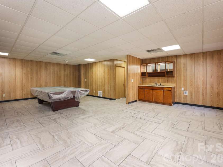 682 Cecil Street, Thomasville, NC 27360.  MLS# CAR4411361, YatesRealty ID 9827. Basement den