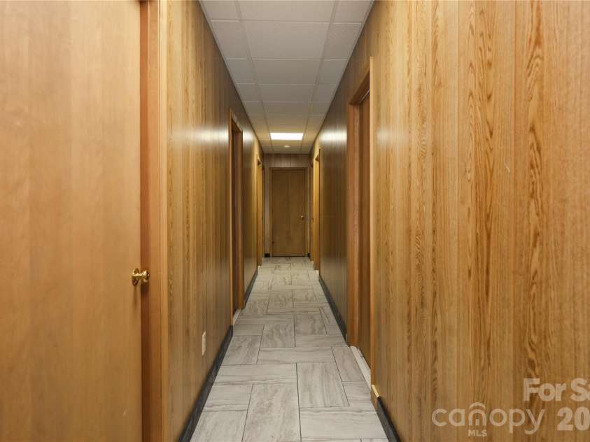 682 Cecil Street, Thomasville, NC 27360.  MLS# CAR4411361, YatesRealty ID 9827. Basement hallway