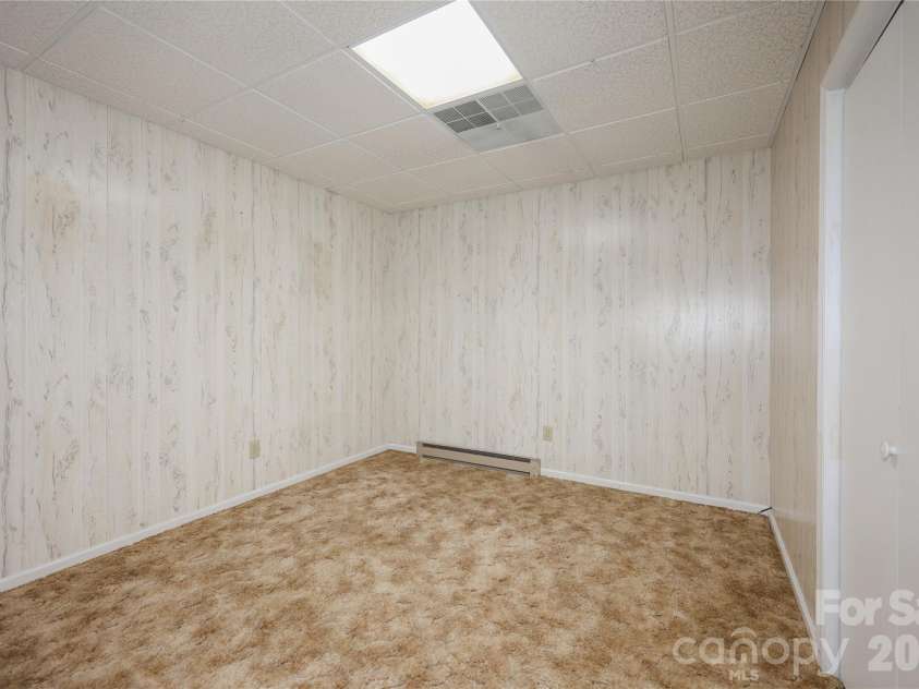 682 Cecil Street, Thomasville, NC 27360.  MLS# CAR4411361, YatesRealty ID 9827. Basement room