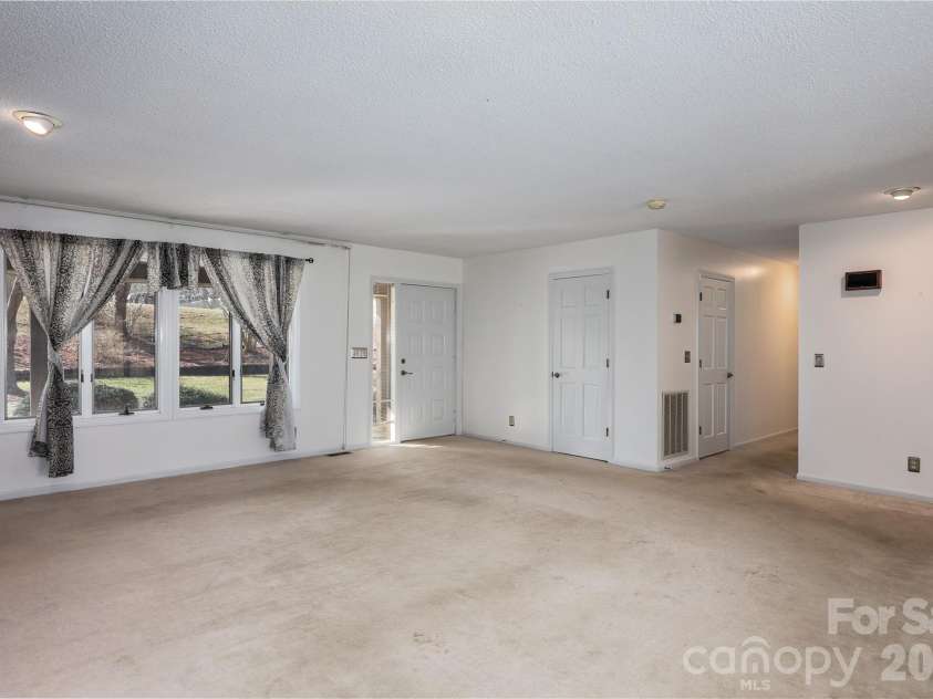 682 Cecil Street, Thomasville, NC 27360.  MLS# CAR4411361, YatesRealty ID 9827. Den from front door