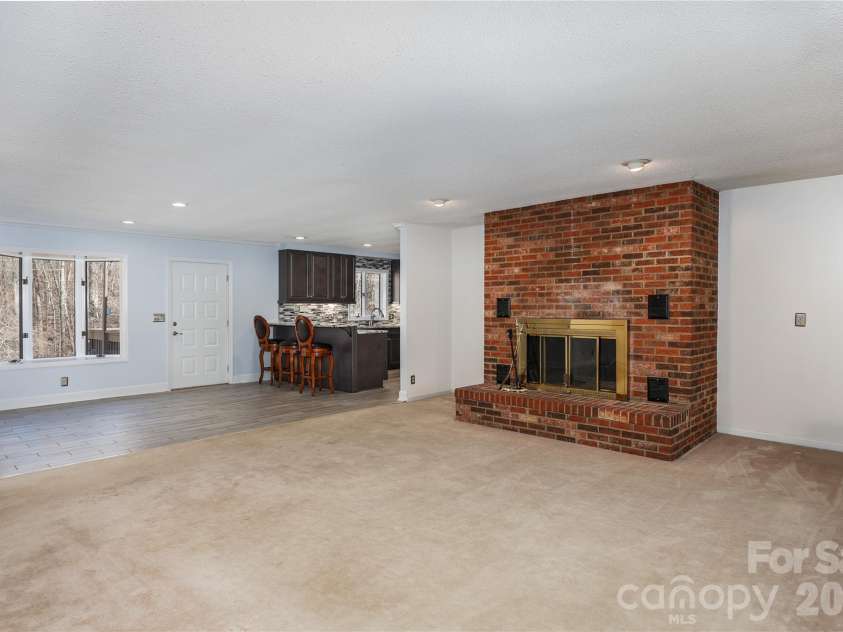 682 Cecil Street, Thomasville, NC 27360.  MLS# CAR4411361, YatesRealty ID 9827. Den with fireplace