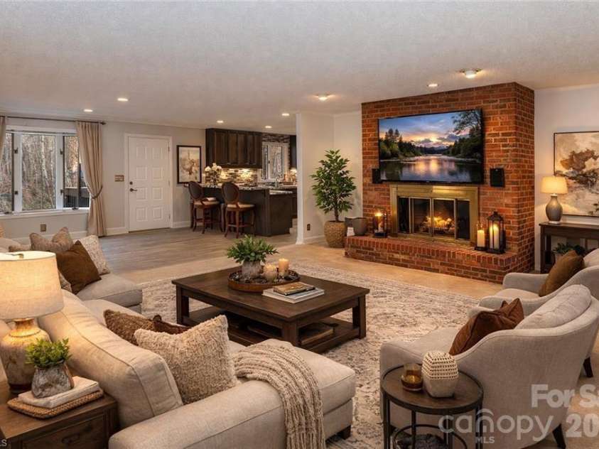 682 Cecil Street, Thomasville, NC 27360.  MLS# CAR4411361, YatesRealty ID 9827. Den with fireplace, virtually staged